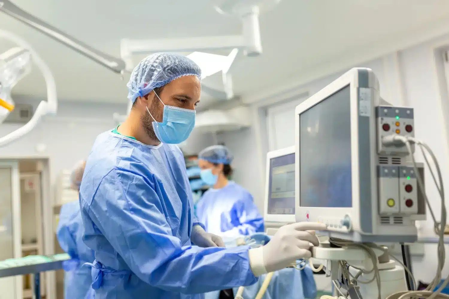 Doctor operating advanced medical equipment in a modern operating room