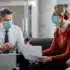 Healthcare professionals meeting with financial advisor to discuss medical business financing & low-revenue funding options.